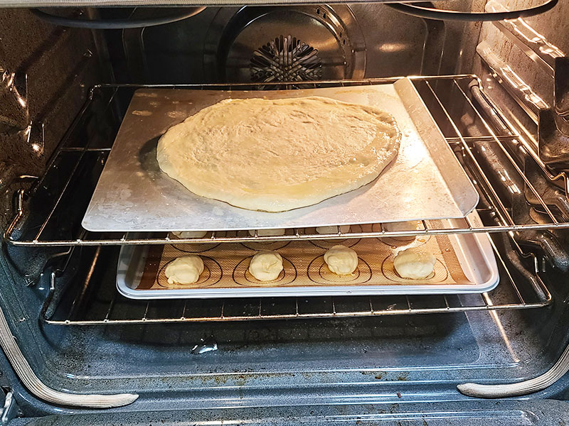 pizza dough and rolls in the oven