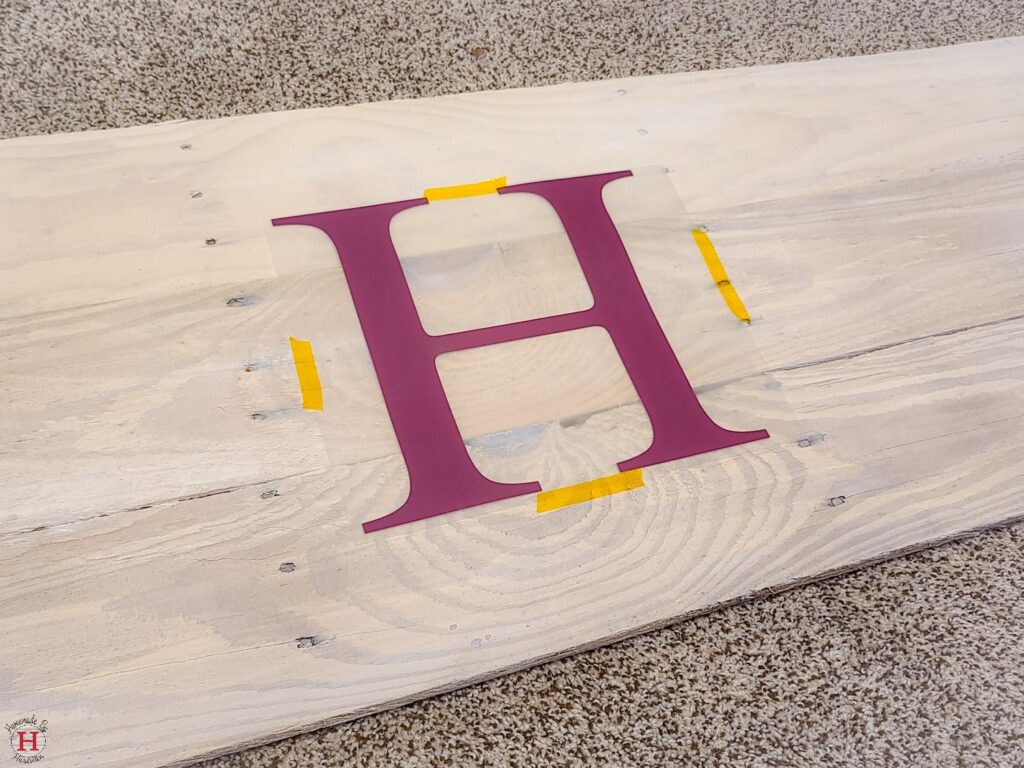 placing HTV on wood with heat resistant tape