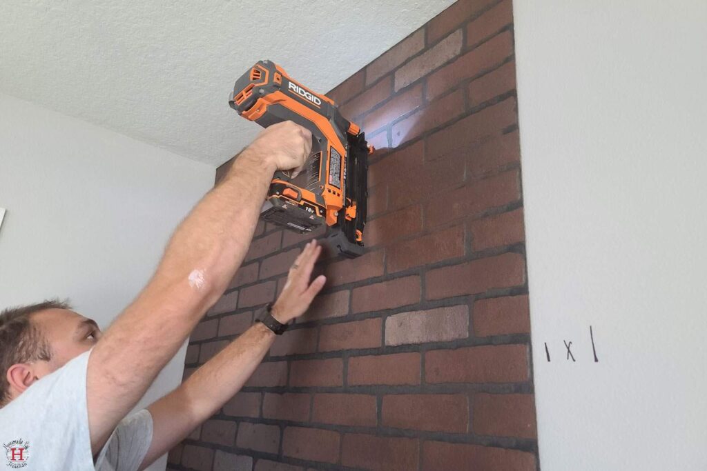 nail gun to install faux brick accent wall panel