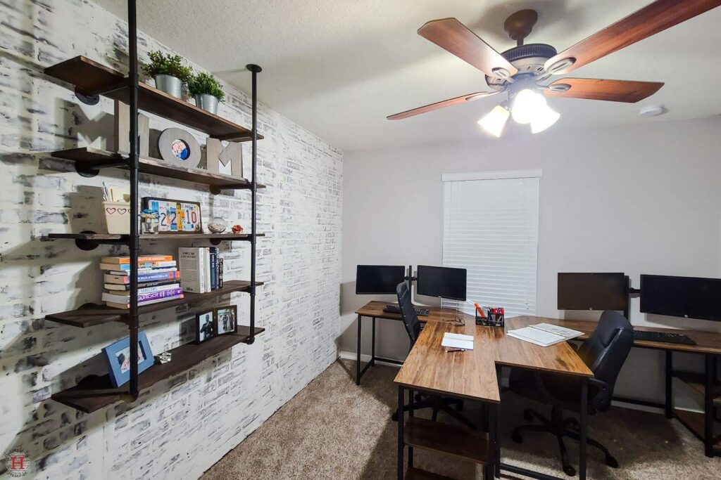 home office with a faux brick accent wall 