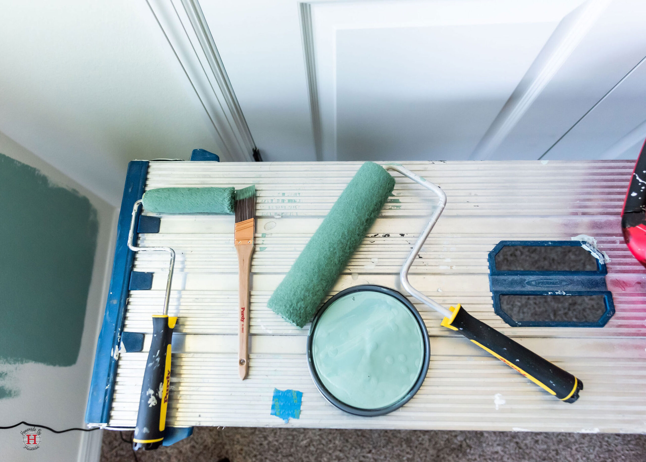 painting supplies with light green paint